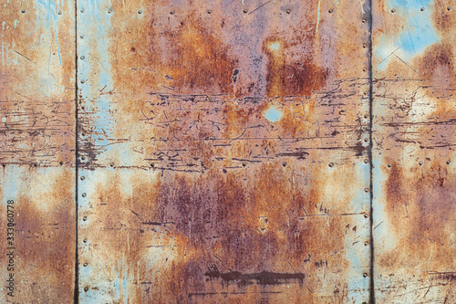 rusty metal texture background, old scratched iron wall with seams and rivets