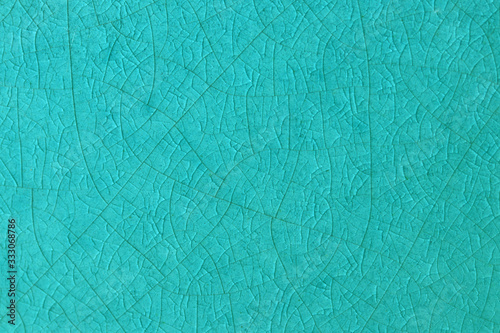 Ocean blue crack ceramic tile. Sea color of glazed tile texture abstract background. Texture of turquoise crackle glass mosaic tile. photo