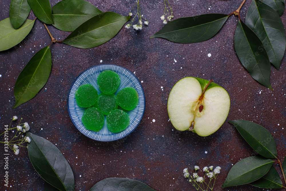 Apple green marmalade candy in sugar. Healthy dessert for gourmets. Apple green marmalade candy in sugar. Healthy dessert for gourmets.