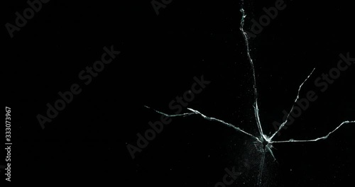 Broken cracks glass fracture effect texture isolated abstract black background. Bullet cracked window with big hole screen mirror weapon shot.