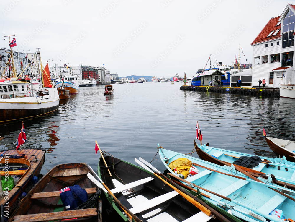 Bergen harbour in Norway. Boats with nowegian flags. 