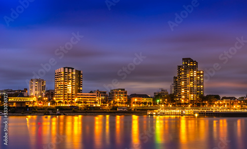 Beatiful night view of Cologne in Germany; the illuminated Rhine and buildings in the night sky