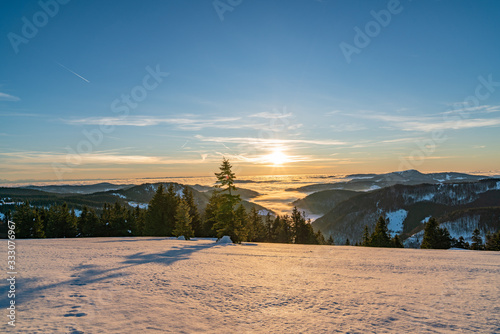Sunset in winter Herzogenhorn, snowy mountains and ski resort under blue sky © Wheat field