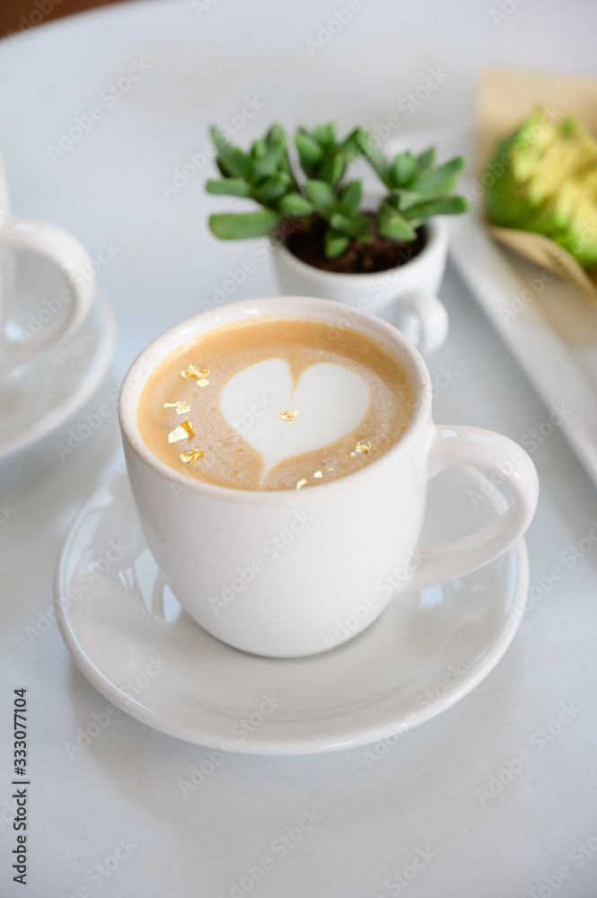 Cafe Latte table set with breakfast and green plant Cafe Latte table set with breakfast and green plant
