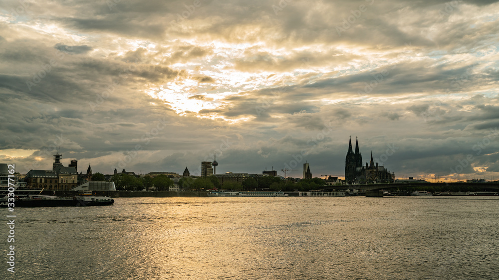View of Cologne at sunset, cityscape in a cloudy day