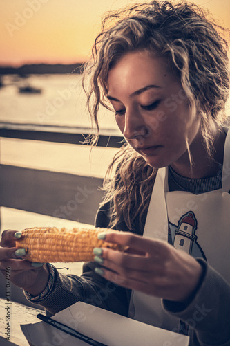 Girl eating corn on the cob