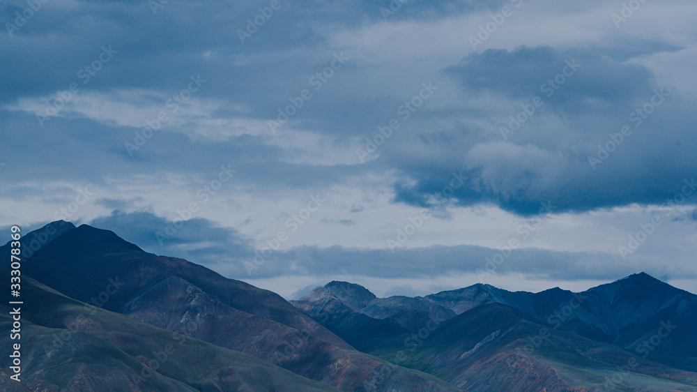 thick clouds over rock ridge, bad weather and waiting for rain in mountains thick clouds over rock ridge, bad weather and waiting for rain in mountains