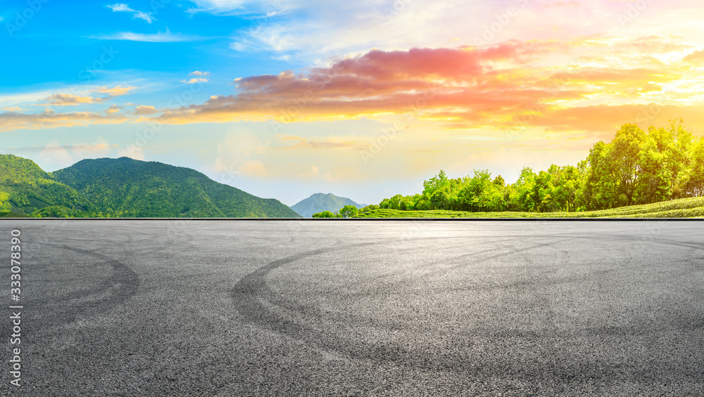 Race track road and green tea mountain nature landscape at sunset,panoramic view.