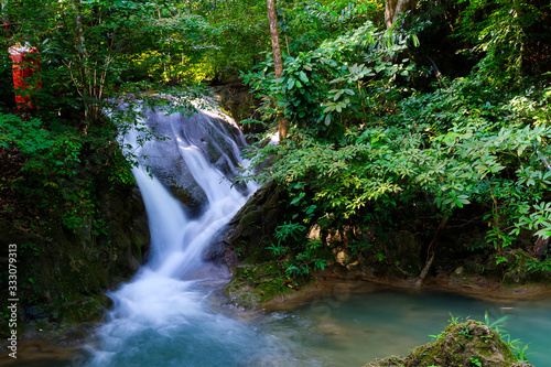 Fototapeta Naklejka Na Ścianę i Meble -  Waterfall the Erawan Waterfall in green forest and is rain forest