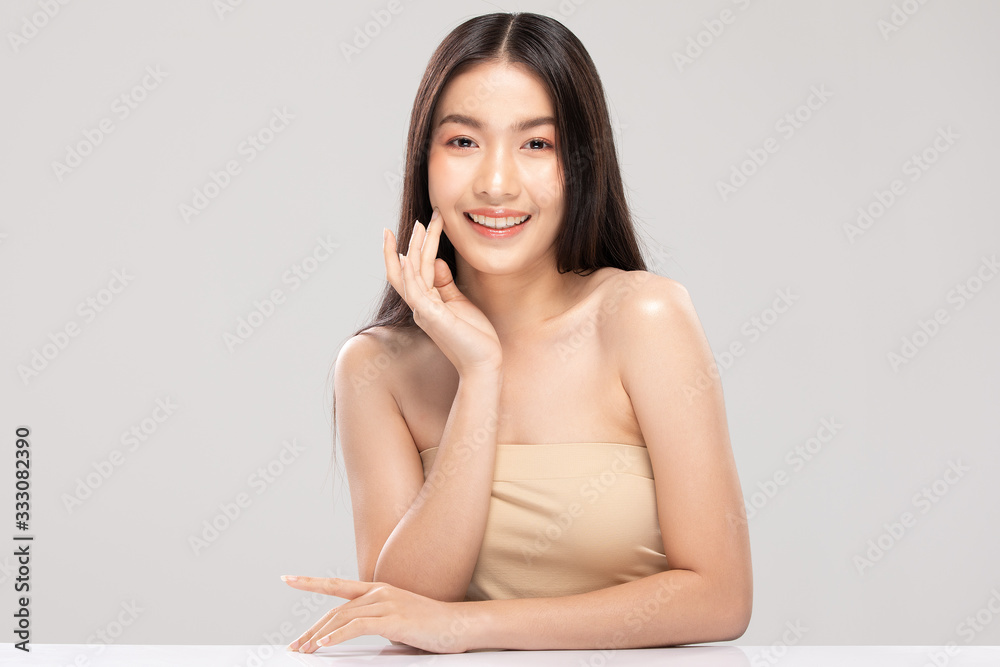 Beautiful Asian woman touching soft cheek smile with clean and fresh skin Happiness and cheerful with positive emotional,isolated on white background,Beauty and Cosmetics Concept Beautiful Asian woman touching soft cheek smile with clean and fresh skin Happiness and cheerful with positive emotional,isolated on white background,Beauty and Cosmetics Concept