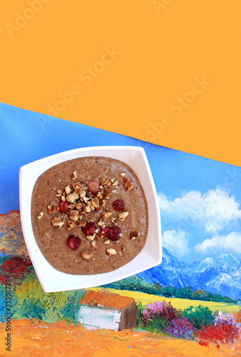 Raw vegan vegetarian food. Flax porridge with walnuts and strawberries. Healthy eating lifestyle. Artist's Breakfast