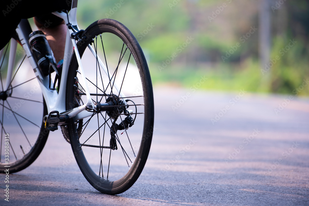 Sports. Asian cyclists ride bicycles on the open road to sunset. Sports. Asian cyclists ride bicycles on the open road to sunset.