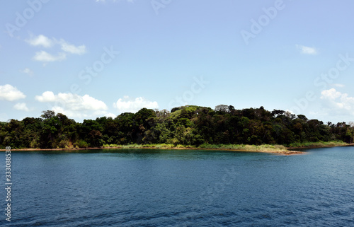 Green landscape of Panama Canal, view from the transiting cargo ship. © Mariusz