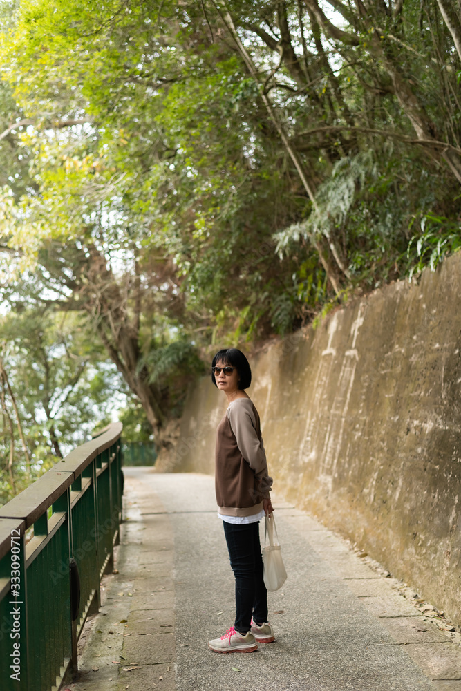 Fototapeta premium Asian woman hiking