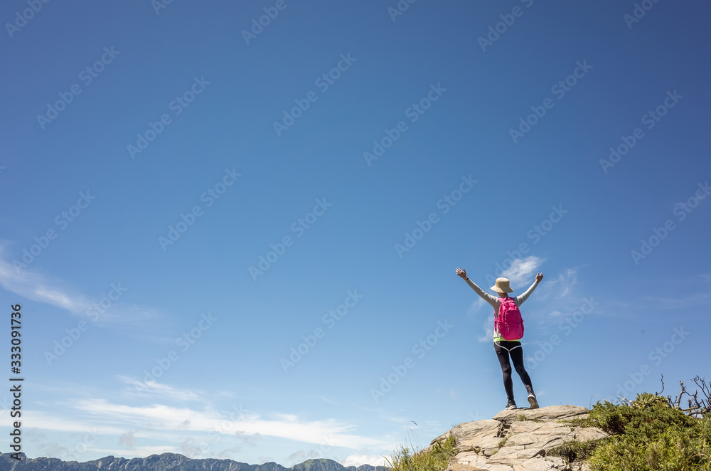 mountain climbing woman stretch and feel free