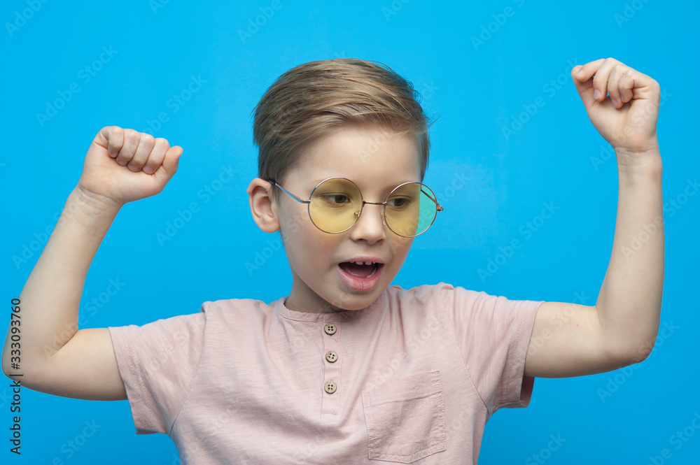 Portrait of a cute little boy with glasses