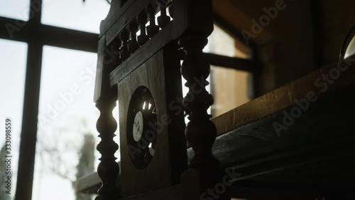The sun filters through the cracks of an ancient chair and creates a glow