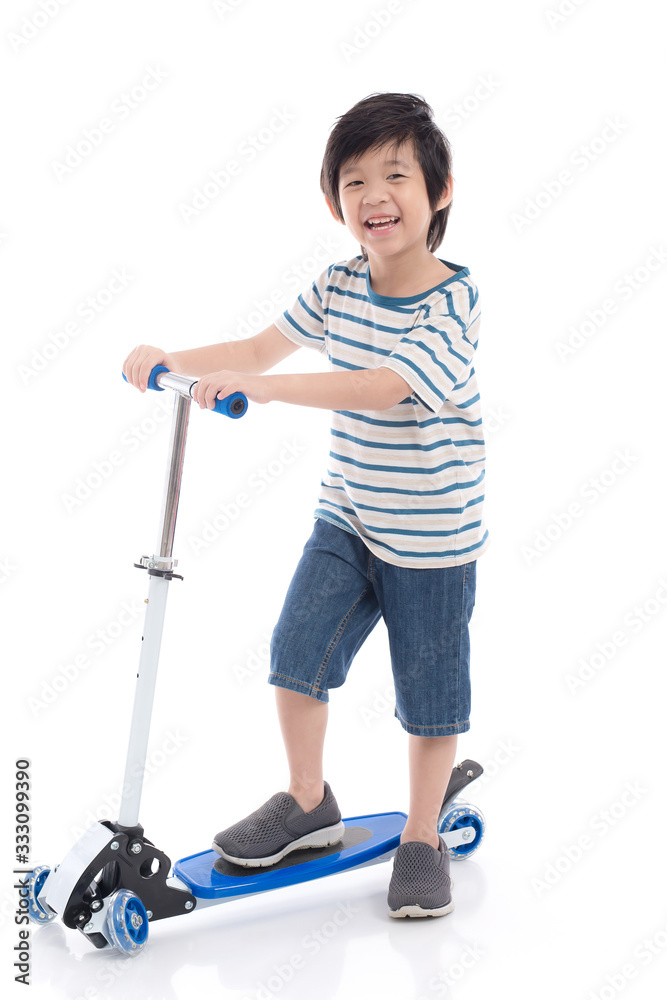Asian boy riding a scooter on white background Asian boy riding a scooter on white background