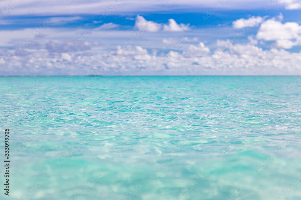 Obraz premium Beautiful Blur defocused blue sea background with palm leaves. Landscape of tropical summer. Summer vacation concept