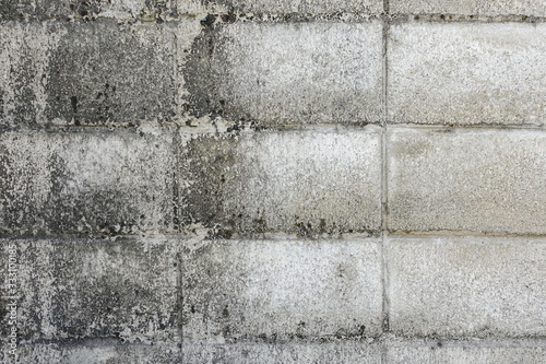 Pattern of grey wall made of concrete bricks