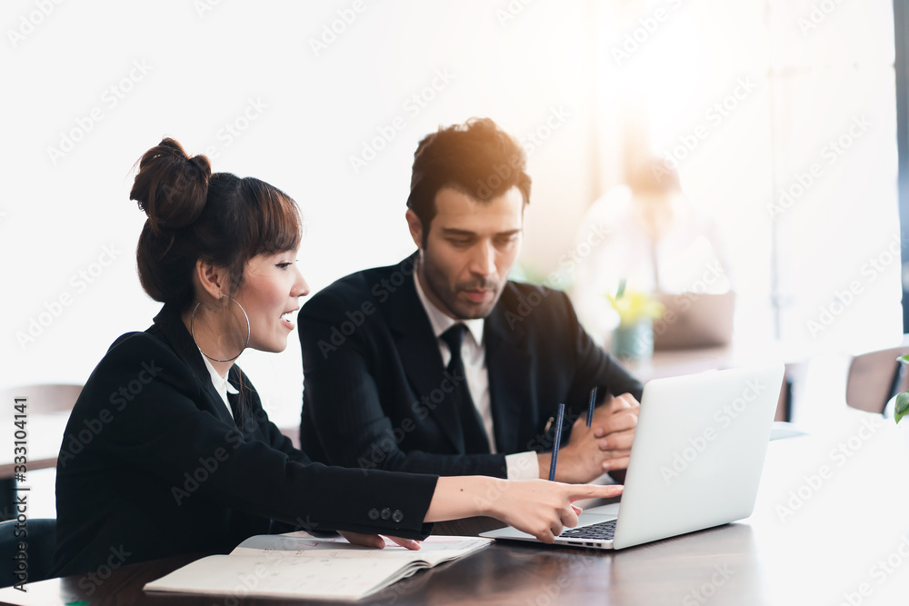 Young asian business group discussion in office workplace. lifestyle social distance friends meeting corporate office. Young asian business group discussion in office workplace. lifestyle social distance friends meeting corporate office.