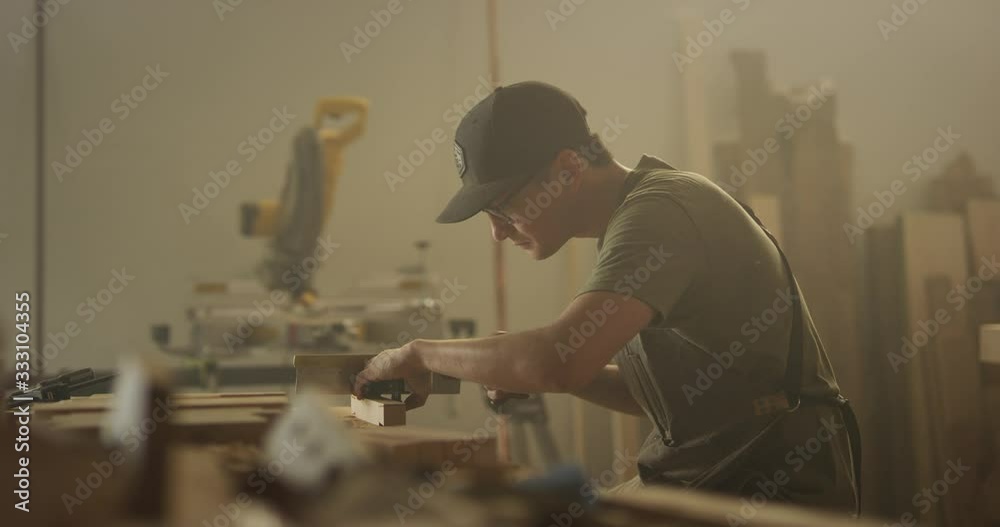 Woodworker man working in garage