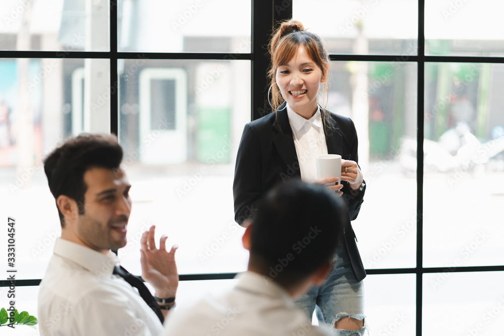 Young asian business group discussion in office workplace. lifestyle social distance friends meeting corporate office. Young asian business group discussion in office workplace. lifestyle social distance friends meeting corporate office.