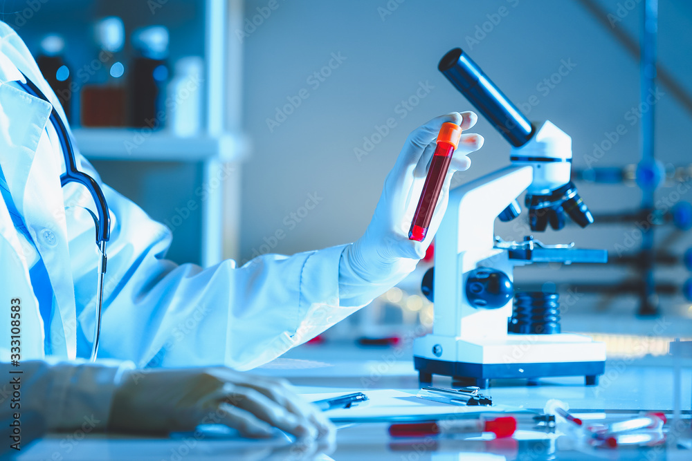 Doctor working with blood samples in laboratory Doctor working with blood samples in laboratory