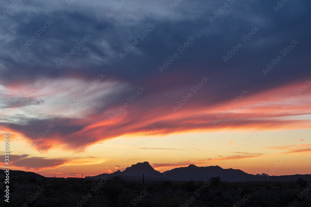 Colorful sunset sky with mountain silhouette