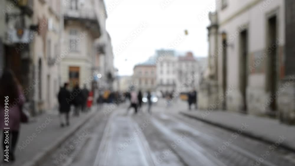 Abstract Defocused Blurred Background of many people on street square Abstract Defocused Blurred Background of many people on street square