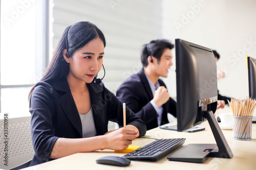 Asia call center workers or Confident business  with headset Customer suppor