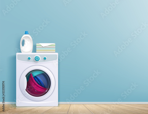 Washing machine in the room in front of the wall.