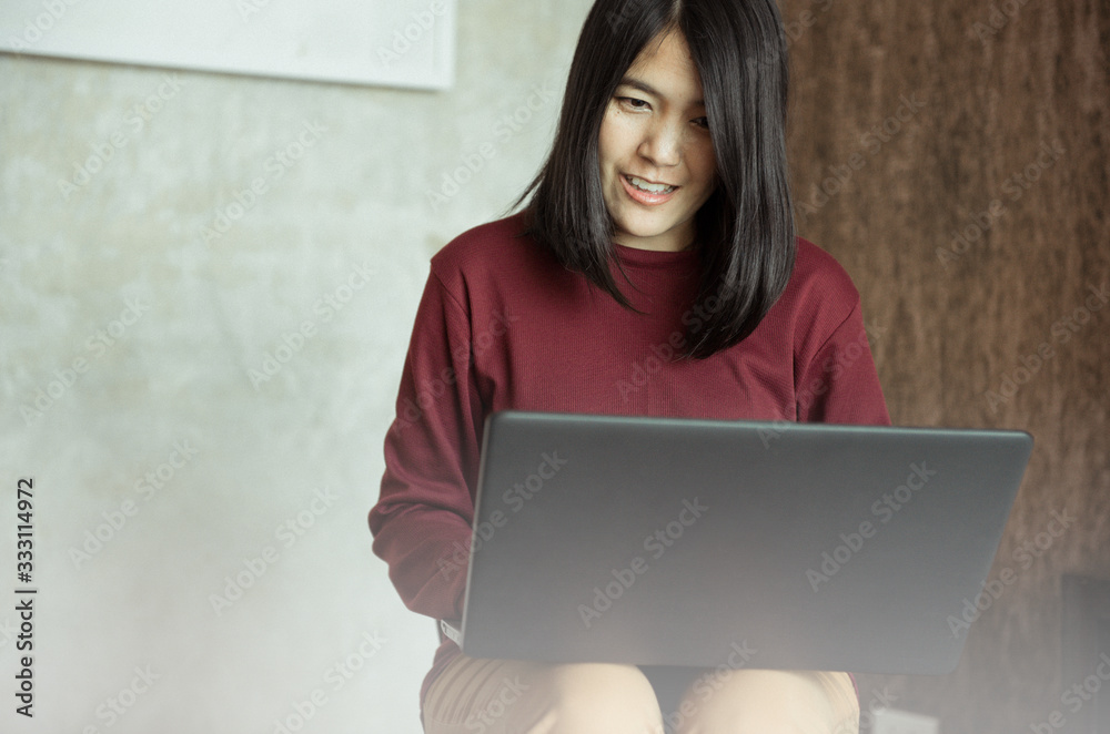 Beautiful young asian women using laptop computer Beautiful young asian women using laptop computer