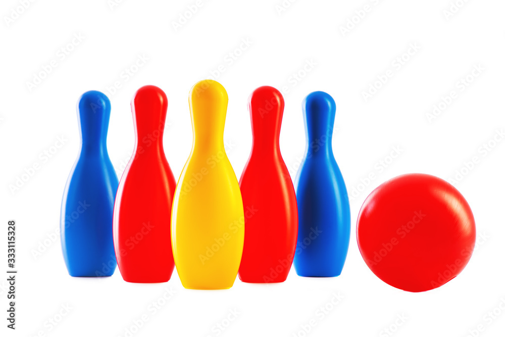 Bowling game. Skittles and ball toys isolated on white background Bowling game. Skittles and ball toys isolated on white background