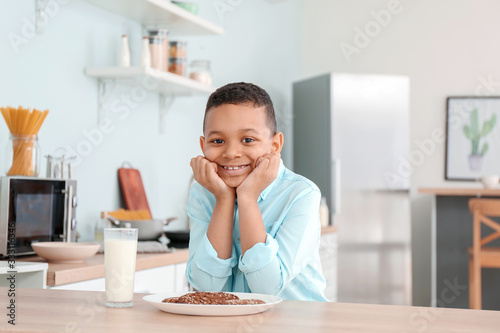 African-American boy drinki...