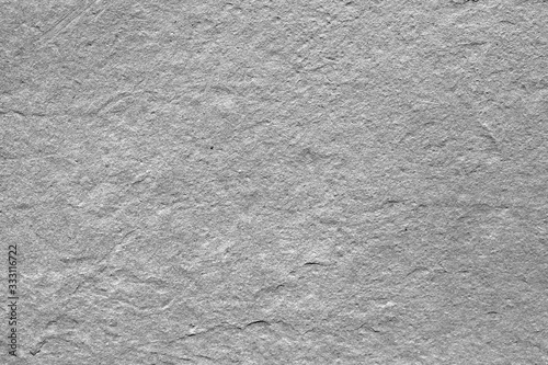 Gray embossed texture of natural stone, marble.