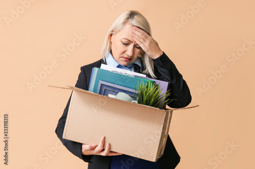 Sad fired mature woman with...