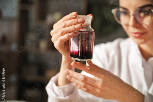 Female alchemist with potio...