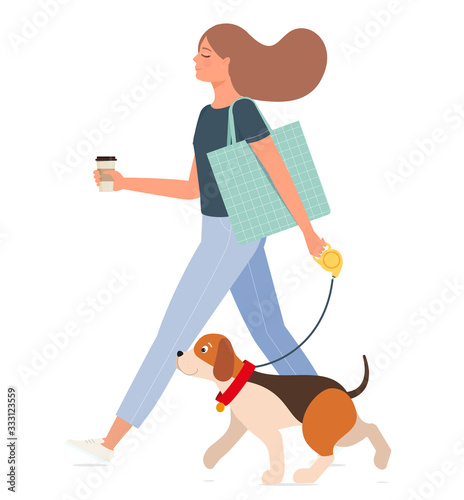 Young happy girl with a cup of coffee walks with a dog.