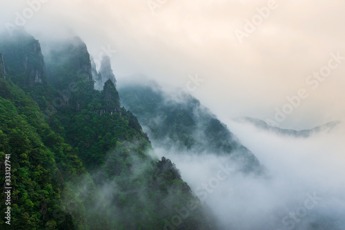 view of mountains in fog