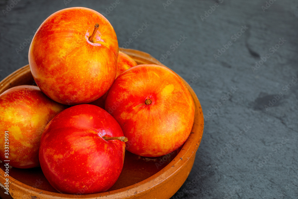 Yellow and orange plums (variety known as honey or mirabelle). Healthy diet based on fruits (detox) . Yellow and orange plums (variety known as honey or mirabelle). Healthy diet based on fruits (detox) .