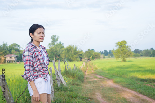 Beautiful asian woman stand relaxing at countryside.