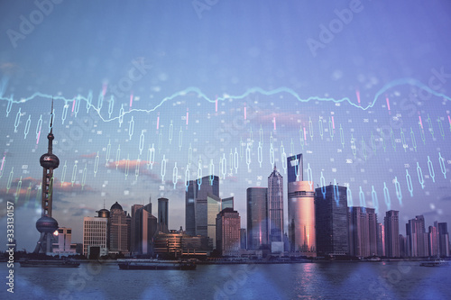 Forex graph on city view with skyscrapers background double exposure. Financial analysis concept.