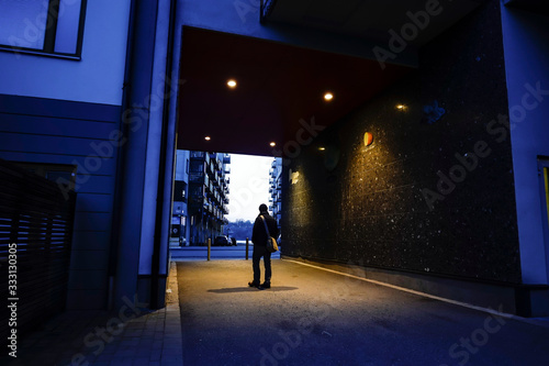 Stockholm, Sweden A man walks through a portal in Liljeholmskajen. photo