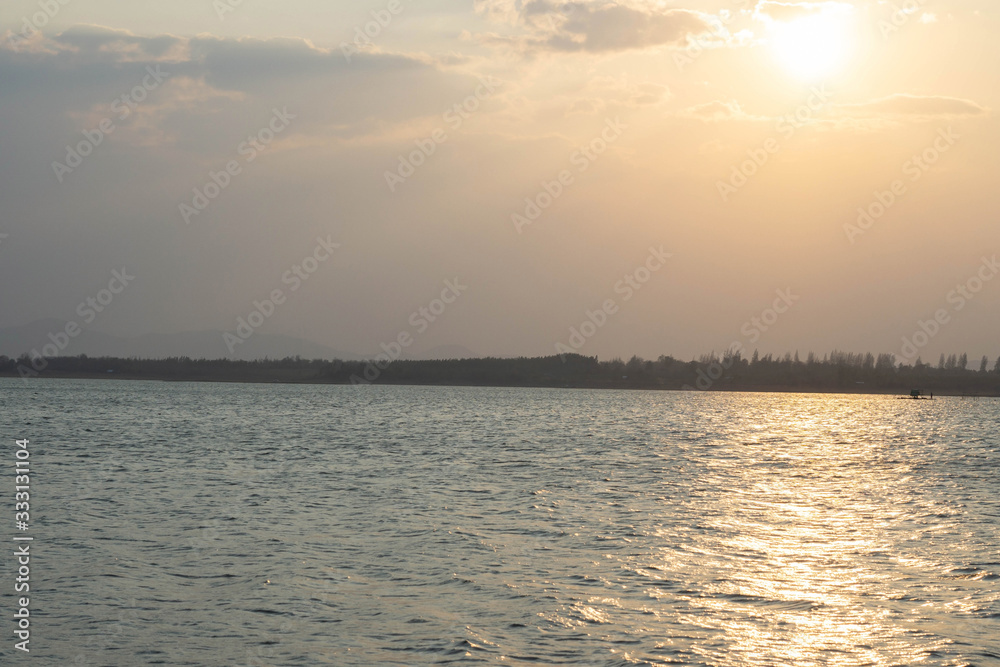 Fototapeta premium Backgrounds Textures Wave Water flow In the river Reflection Light from Sunset