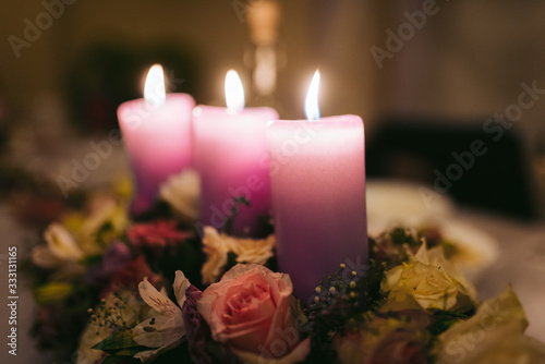 red candle and flowers