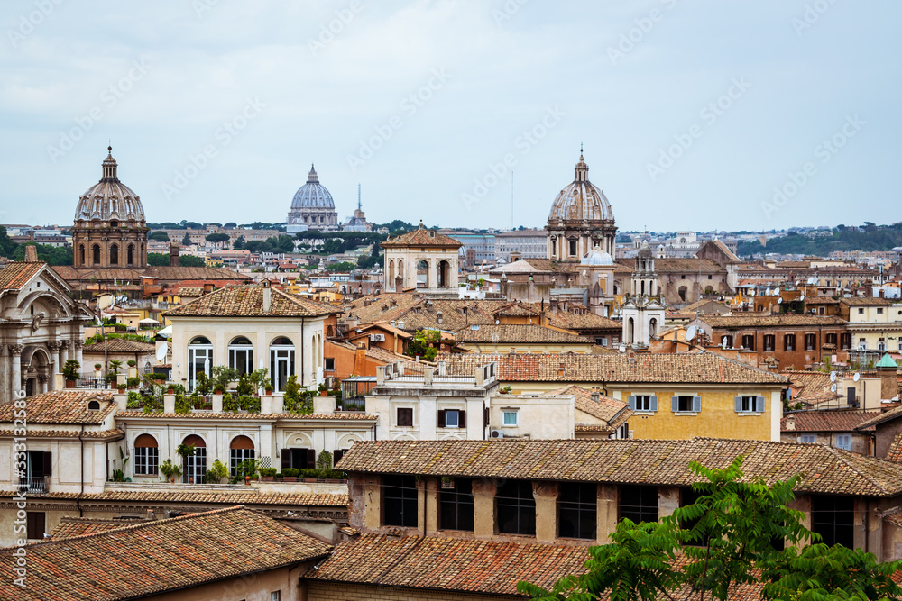 View of Rome, Italy, showing old building, rooftops and church domes