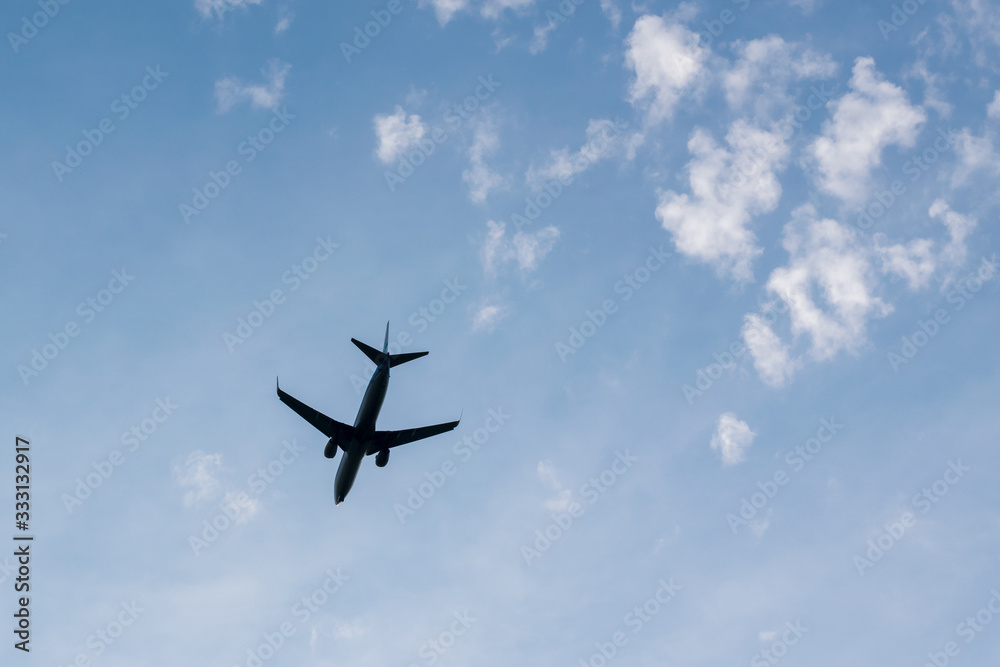 Silhouette of an airplane in the sky Silhouette of an airplane in the sky