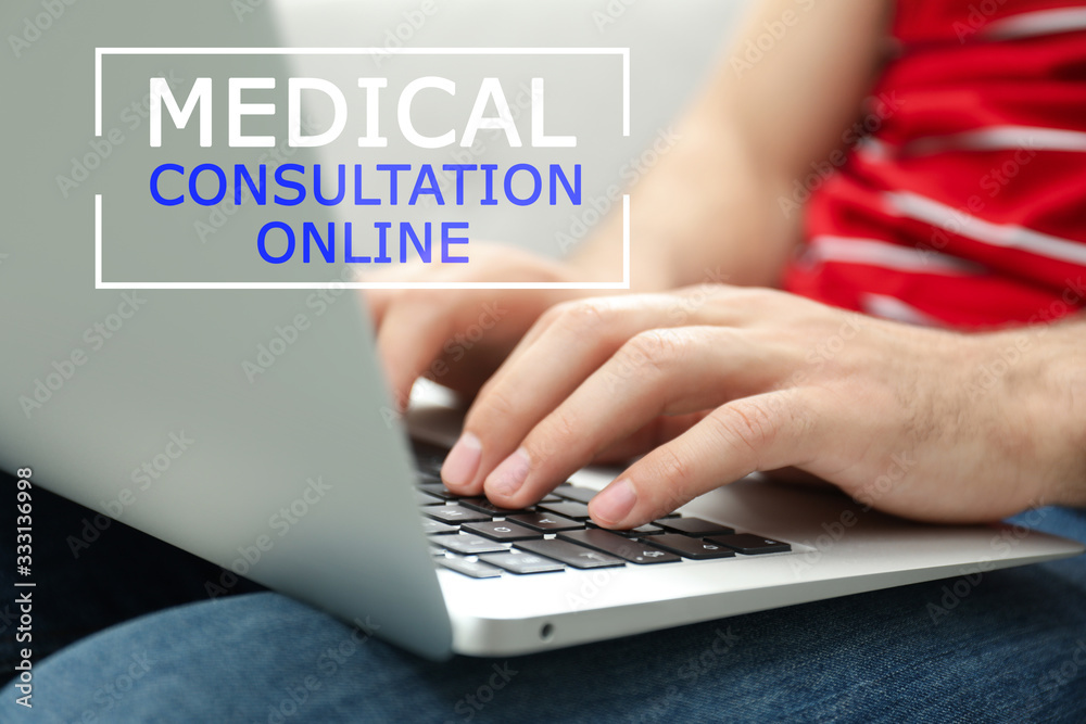 Man with laptop at home, closeup. Medical Consultation Online Man with laptop at home, closeup. Medical Consultation Online
