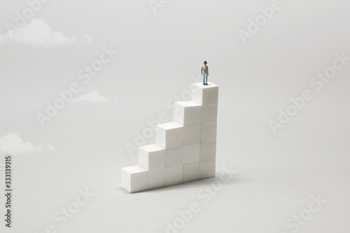 man on the top of stairs observing the future; surreal concept photo